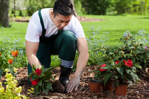 Local garden construction team preparing hard landscaping materials for a Redbridge property